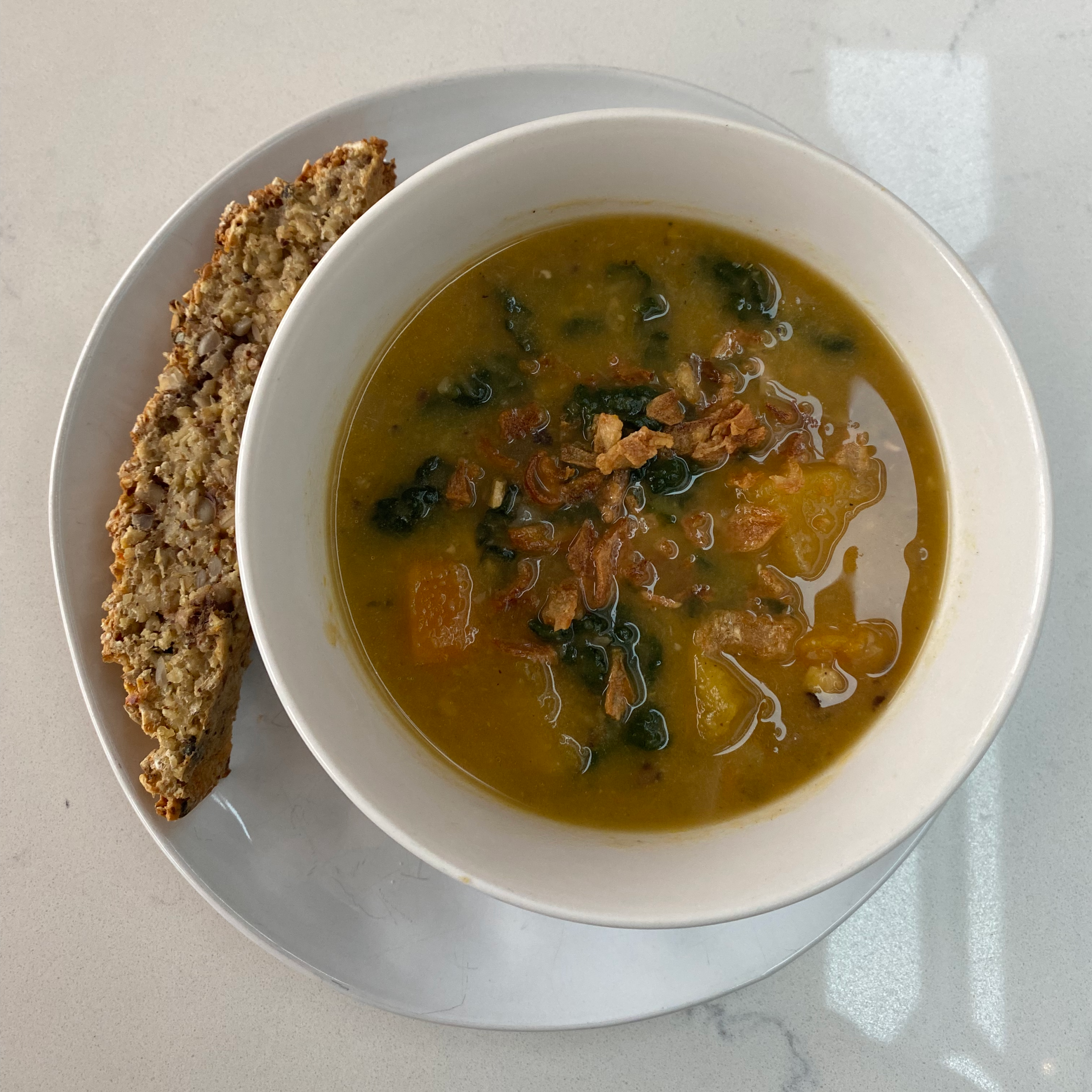 Vegetable soup, oat, seeds and walnut bread.